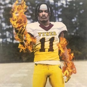 Jeremiah Batiste tyner academy class of 2020 on fire and holding a football in the chattanooga area