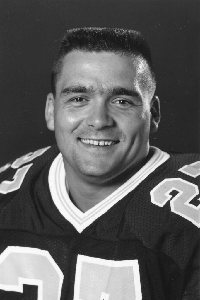 black and white image of football player