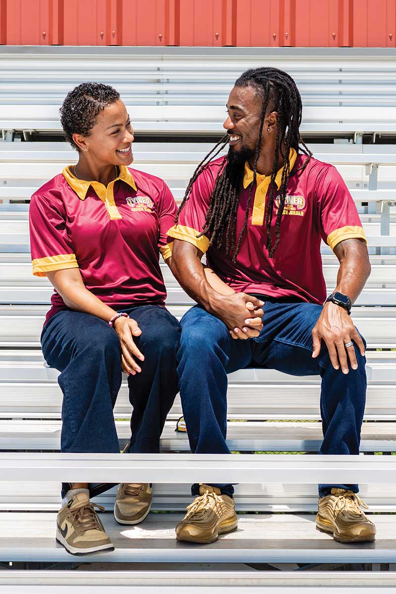 couple sitting on bleachers