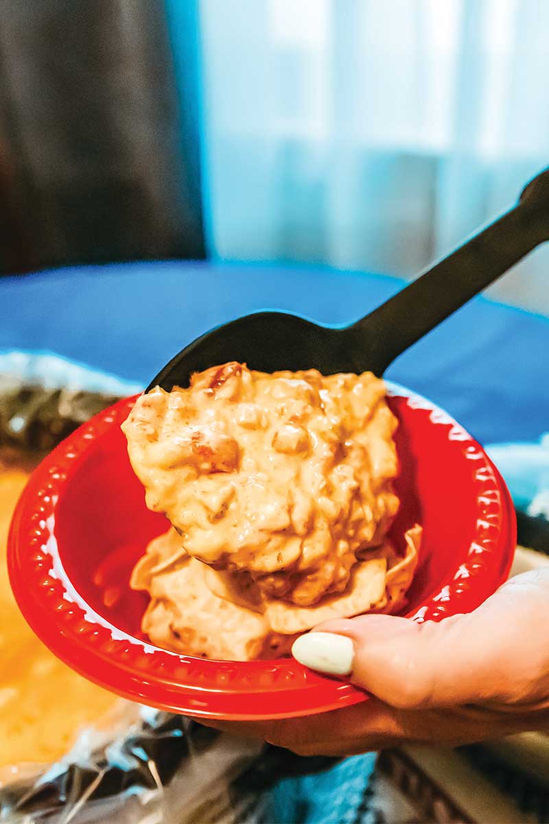 scooping cheese dip