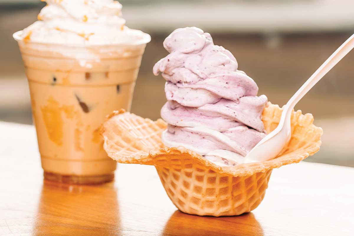ice cream in waffle cone bowl and iced coffee
