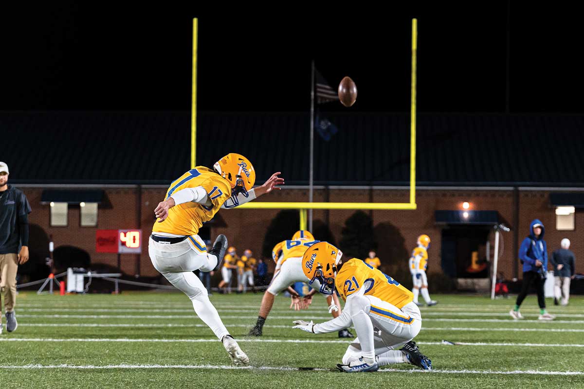 Football player kicking a field goal