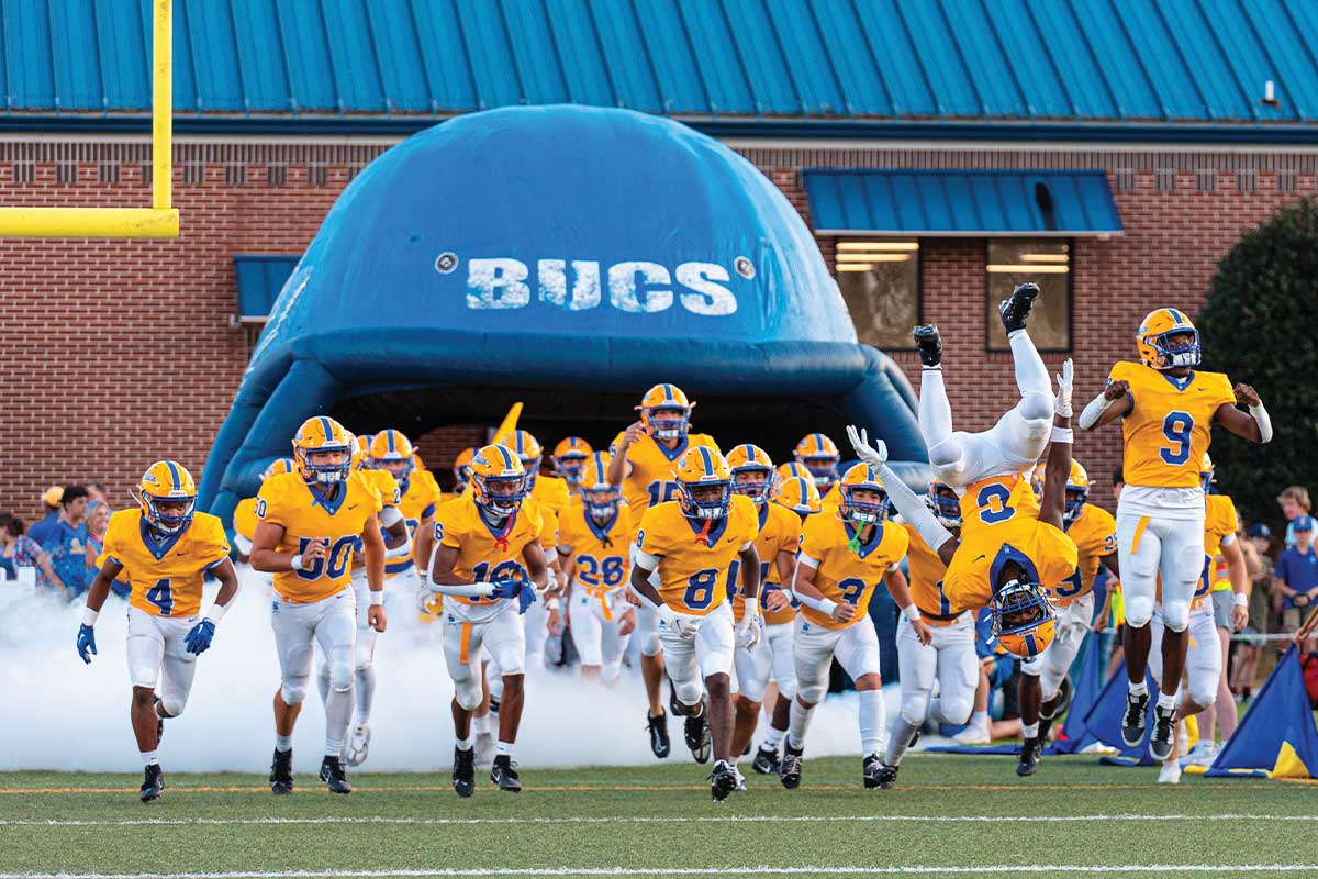 Football team running onto field