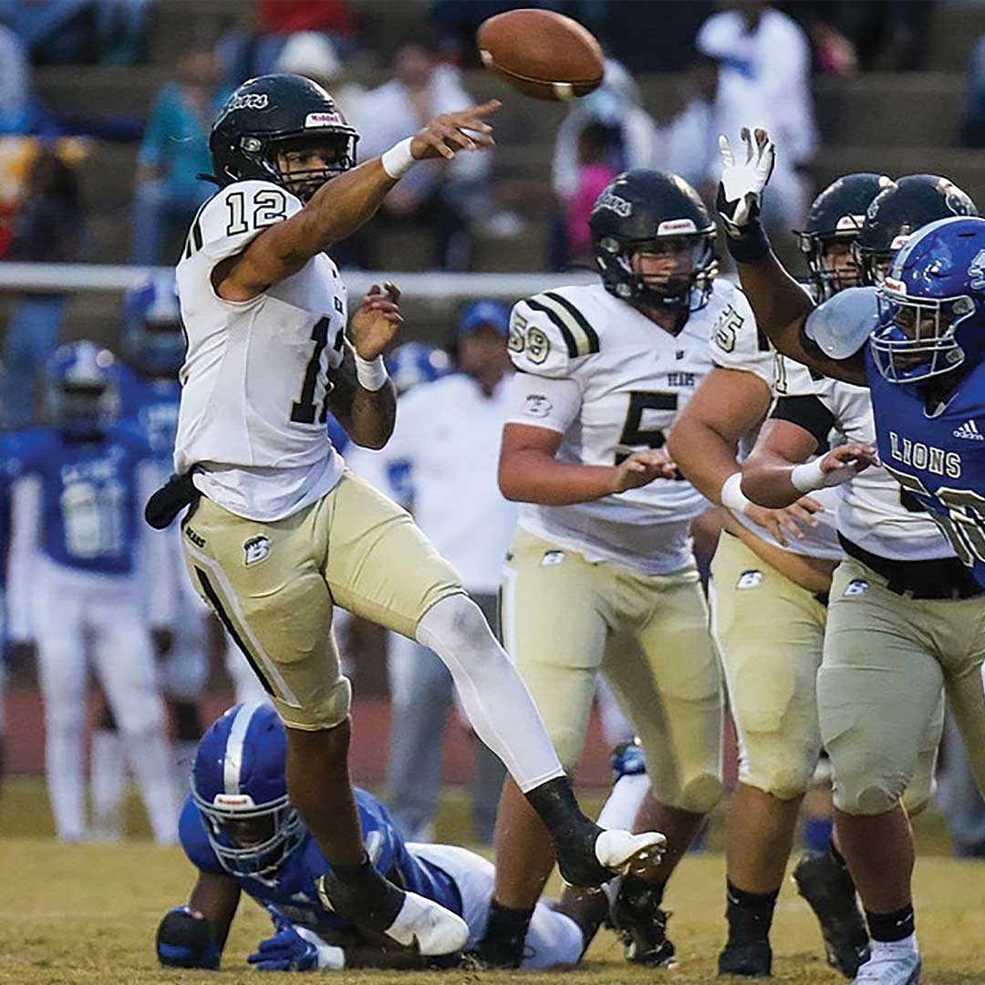 Football player throwing ball