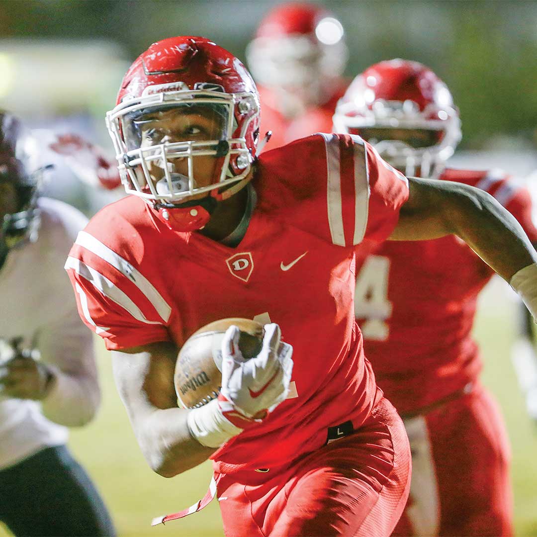 Football player running with ball