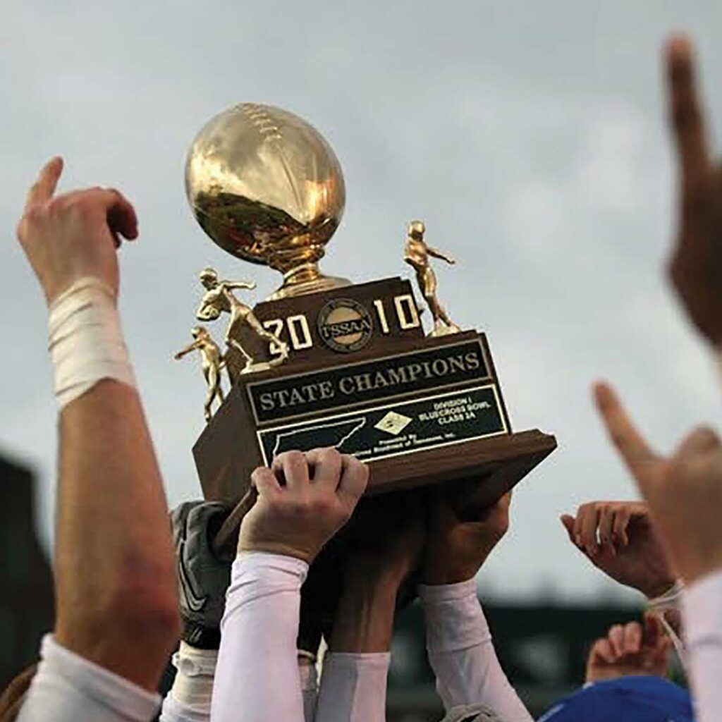 Hands holding up trophy