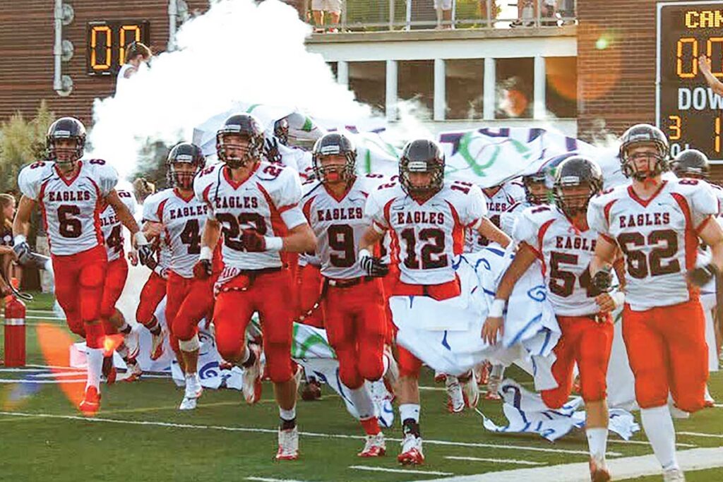 Football team running onto field